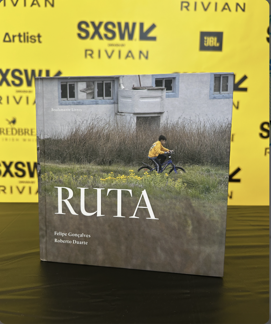 Ruta book displayed at SXSW Rivian backdrop